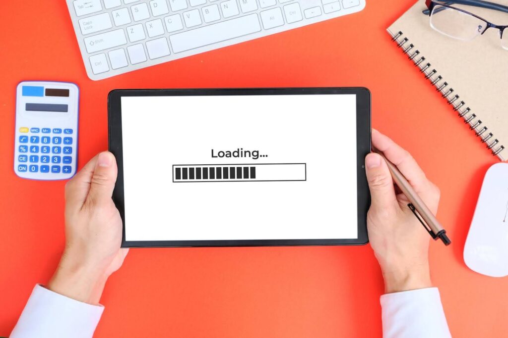 Digital marketing test concept showing a tablet loading screen during a website performance check for speed and user experience.