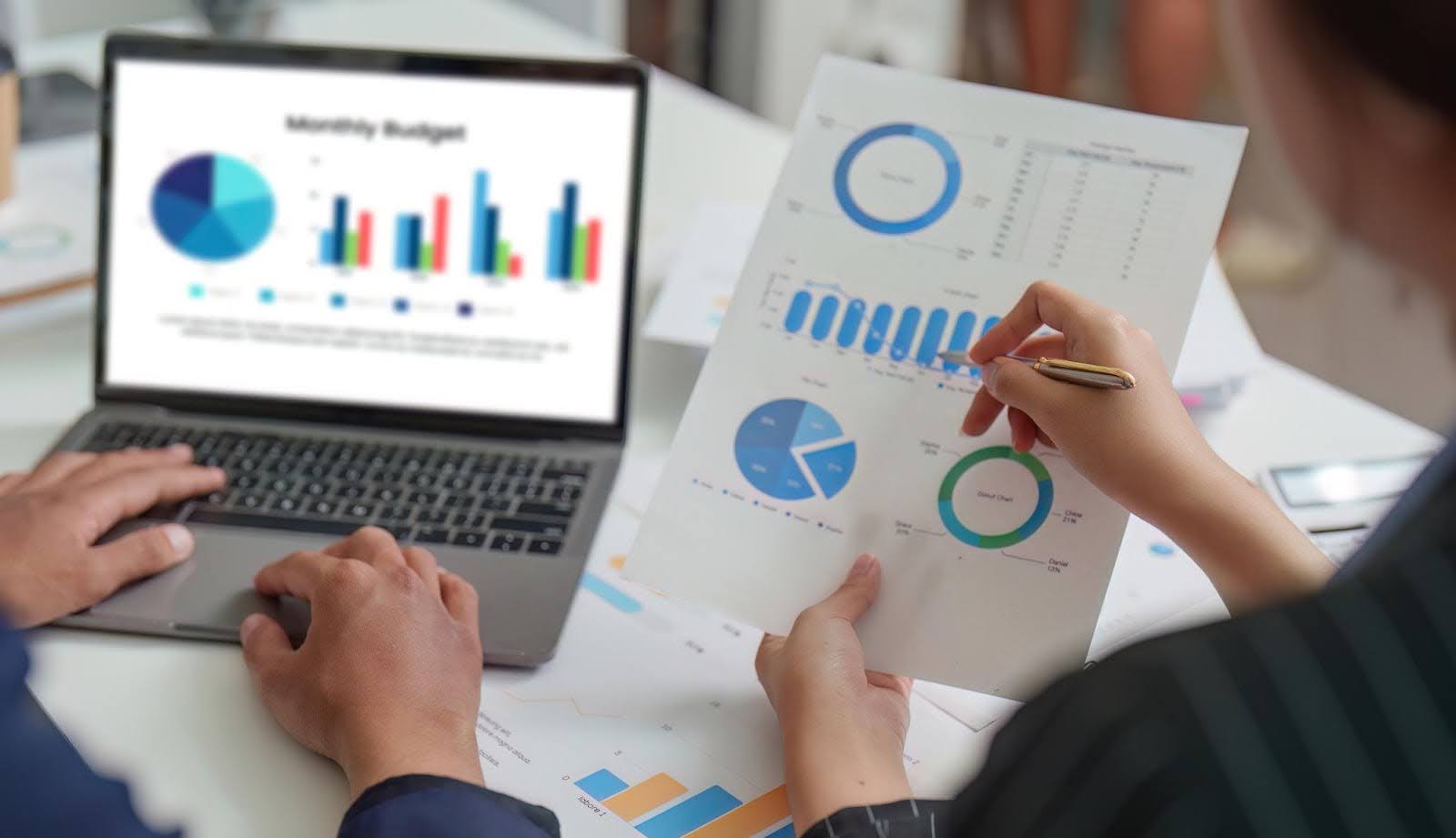 Tech Fellow team reviewing analytics dashboards and reports, illustrating data-driven marketing campaigns that help small businesses compete with big brands.