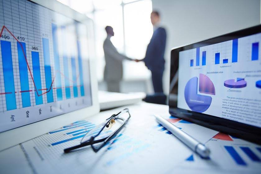 Business professionals reviewing performance analytics to identify whether a marketing problem involves traffic, trust, or conversion with Techfellow.