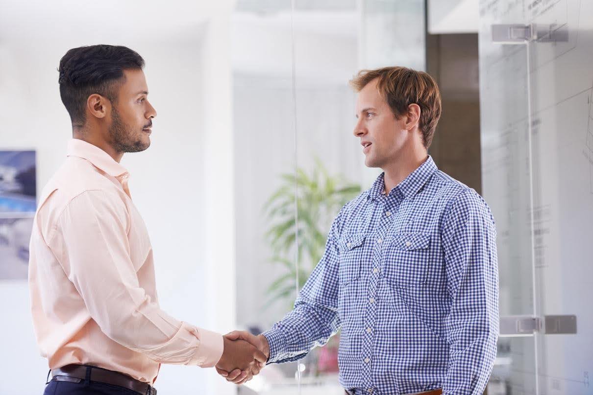 Business team managing increased marketing demands and back-end support operations with Techfellow.