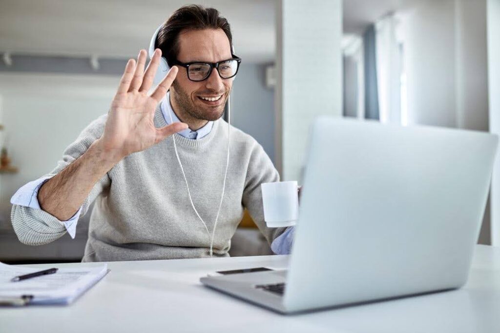 Business owner on a video call while managing admin work and daily operations for Techfellow.