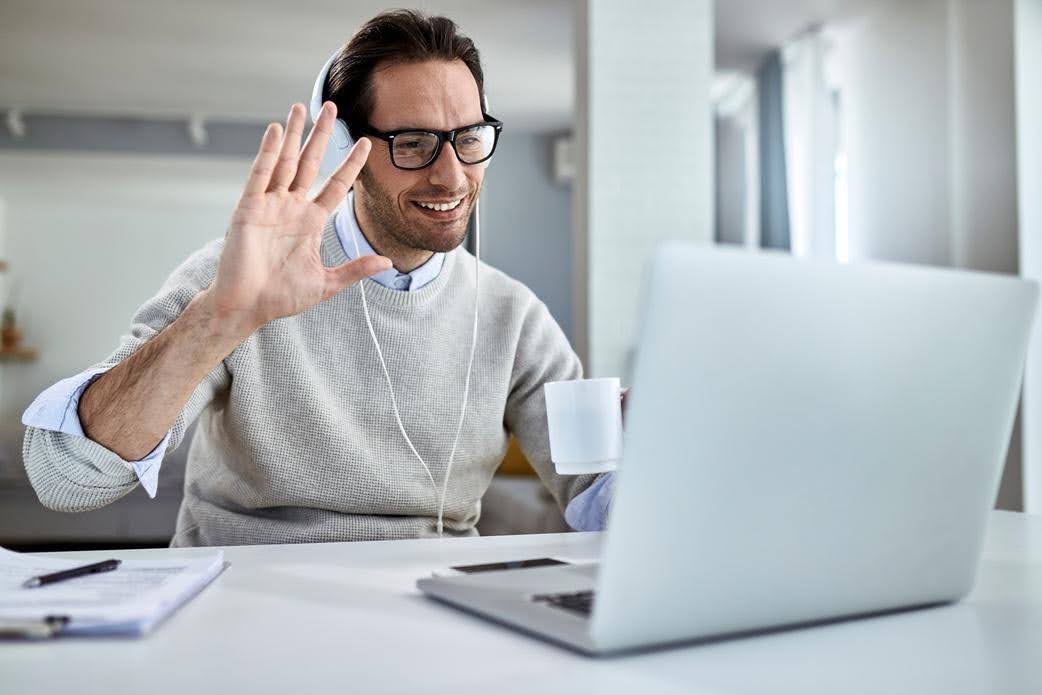Business owner on a video call while managing admin work and daily operations for Techfellow.