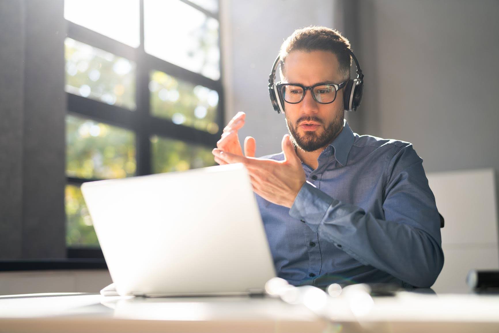 Business owner working remotely with a virtual assistant for flexible support as a growing business manages increasing workloads with Techfellow.