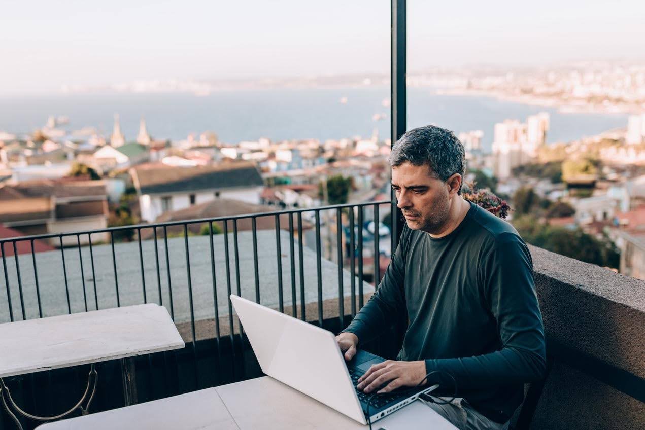 Business professional working remotely on a laptop, illustrating how a virtual assistant can help growing businesses manage customer communication and follow-ups efficiently.