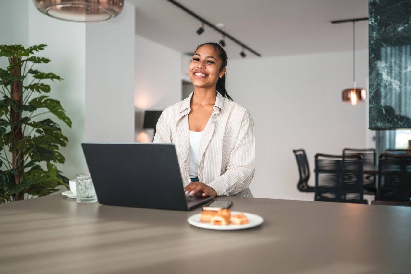 Business professional working on a laptop to manage leads and customer follow-ups, highlighting the importance of an organized lead follow-up process for business growth.